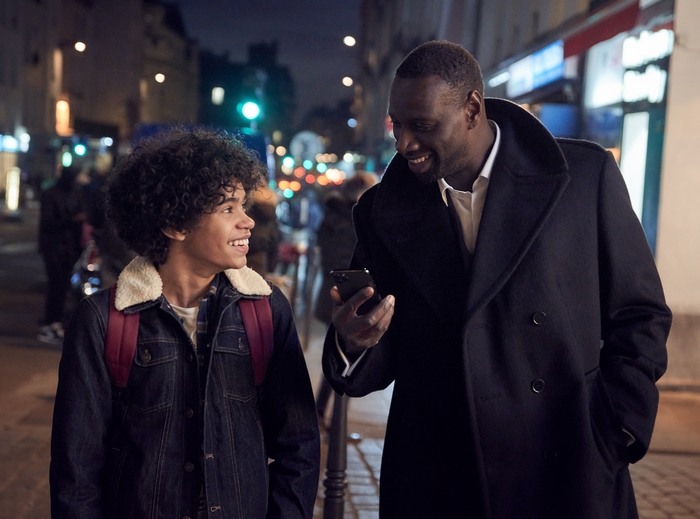 Assane Diop and son from Lupin on a street