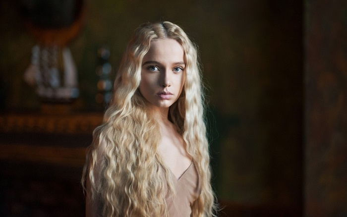 Woman with long blonde hair and blue eyes