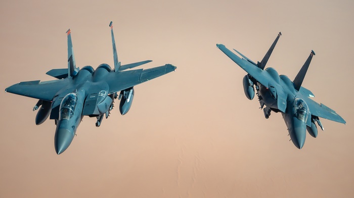Two United States Air Force F-15 fighter jets in flight