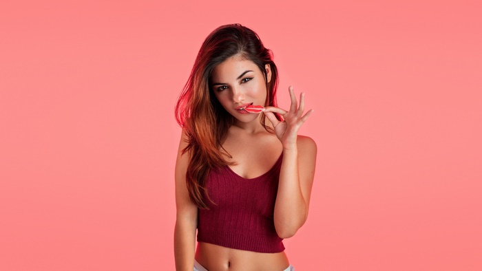 Woman with red lips candy