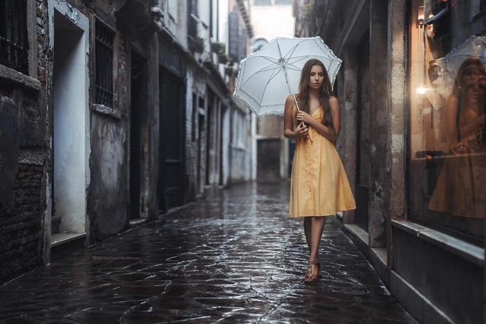 Woman in Yellow Dress Holding Umbrella
