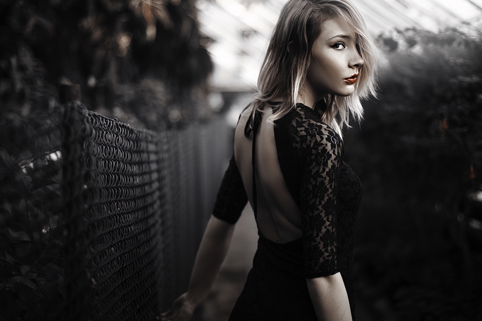 Blonde woman in black lace dress