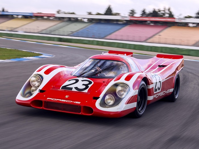 Red Porsche 917 race car with number 23 on track