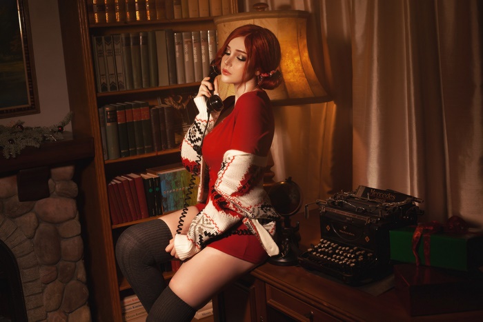 Woman with red hair on the phone