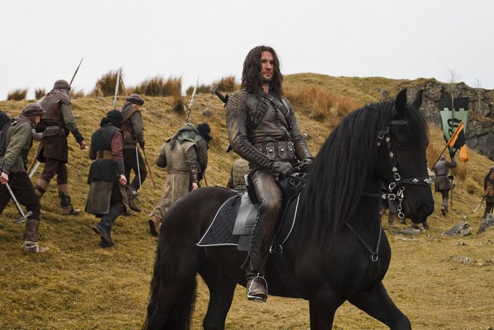 Cenred from Merlin on horseback with soldiers