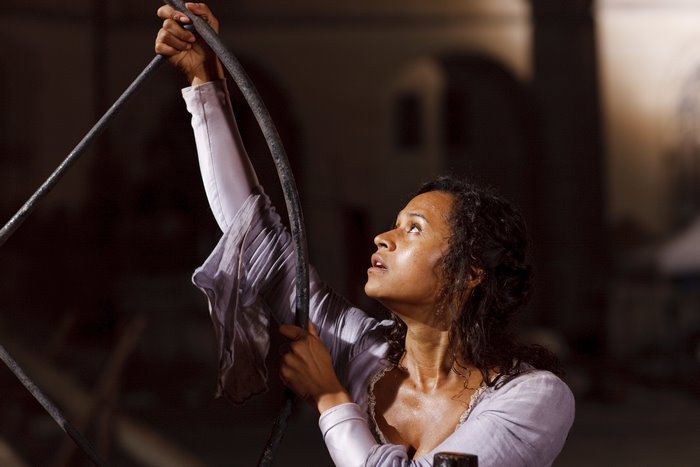 Guinevere from Merlin holding a metal structure