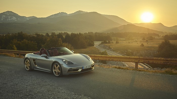 Silver Porsche Boxster Convertible on Mountain Road