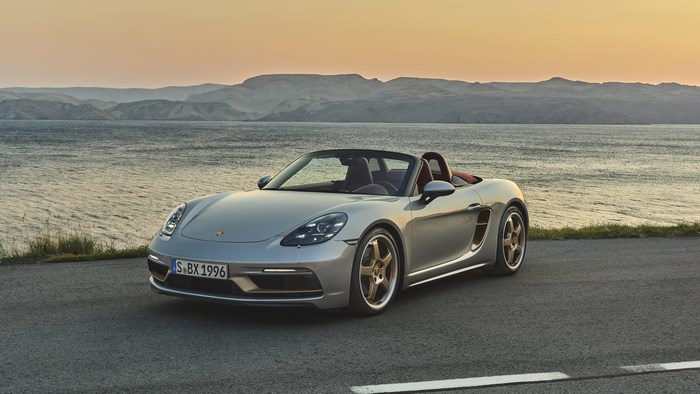 Silver Porsche Boxster 4K by the water