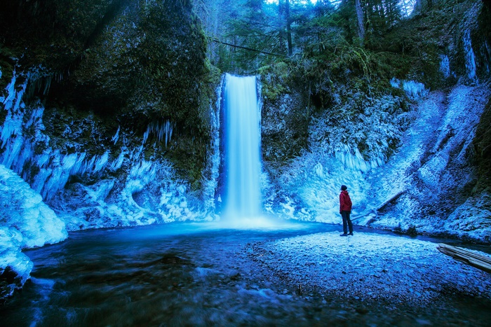 Frozen Waterfall in Oregon Forest with Person