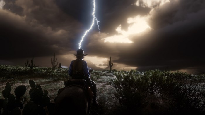 Red Dead Redemption 2: Lightning strikes a cowboy on horseback