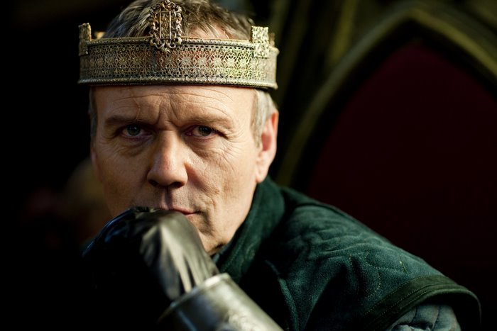 Uther Pendragon from Merlin wearing a crown