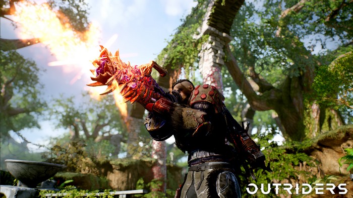 Outriders character firing a weapon in a forest