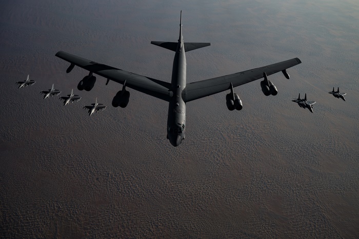 USAF B-52 Bomber escorted by F-15 and F-16 fighter jets