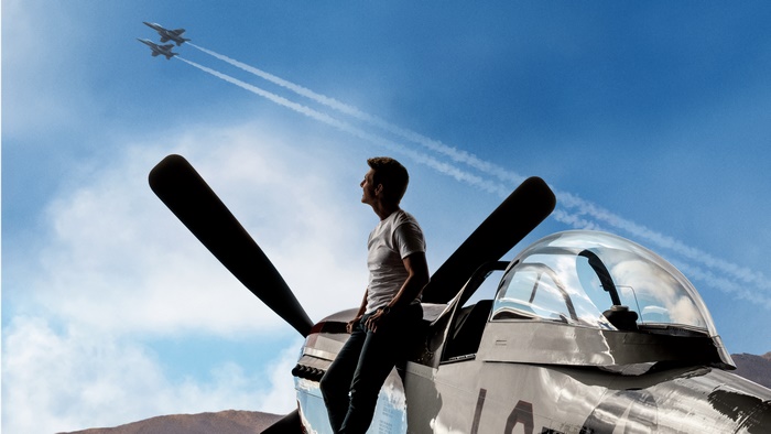 Tom Cruise on a vintage airplane