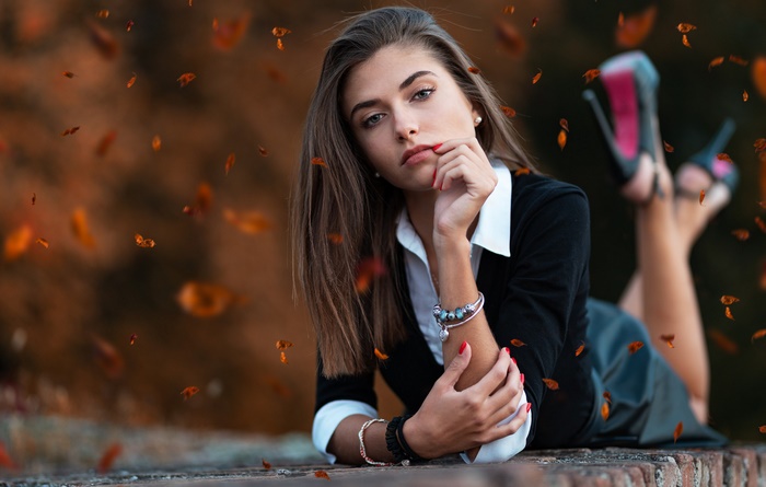 Woman with brunette hair lying down
