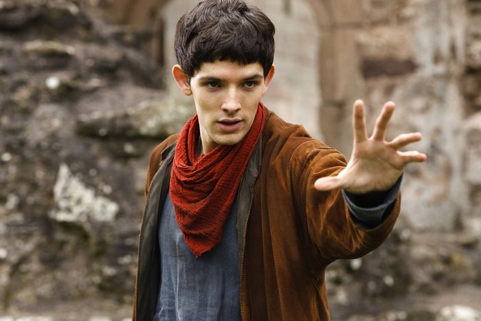 Merlin Extending Hand in Medieval Setting
