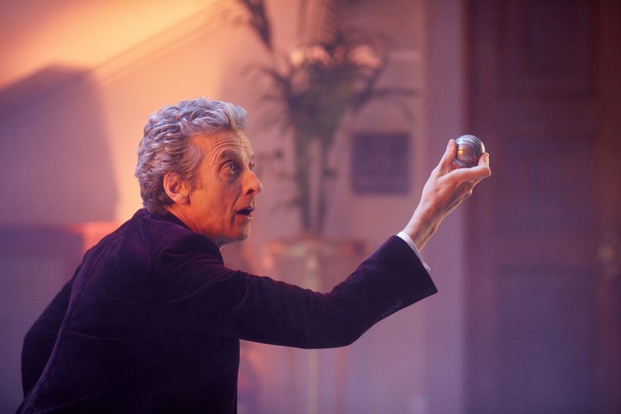 The Twelfth Doctor from Doctor Who holding a sphere