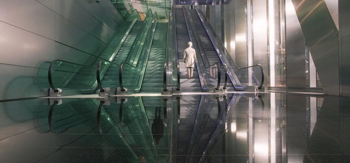 Aziraphale from Good Omens on escalator