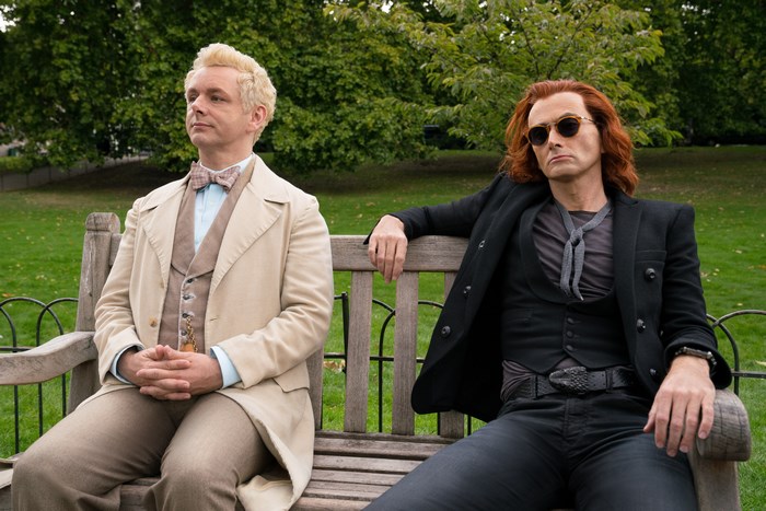 Aziraphale and Crowley from Good Omens sitting on a bench