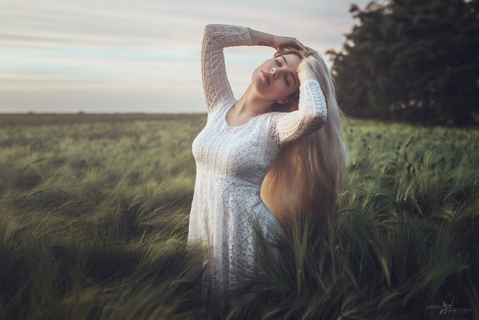 Blonde Woman in White Dress Standing in Field