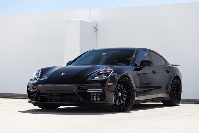 Black Porsche Panamera on a white background
