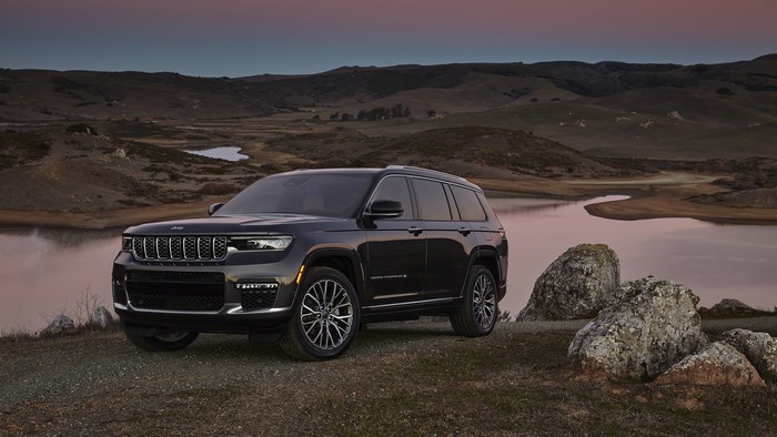 Jeep Grand Cherokee L 4K SUV by a lake