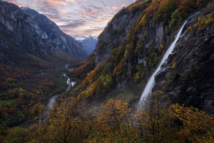 Waterfall in a mountain valley during fall