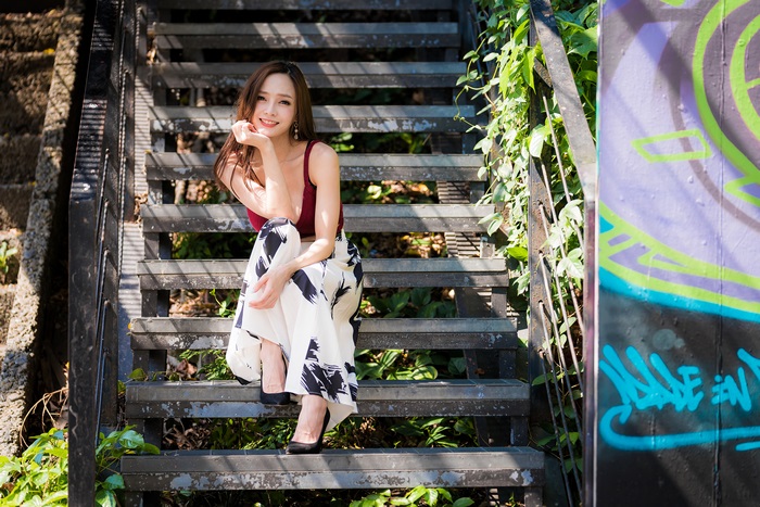 Asian Woman Smiling on Outdoor Stairs 4K