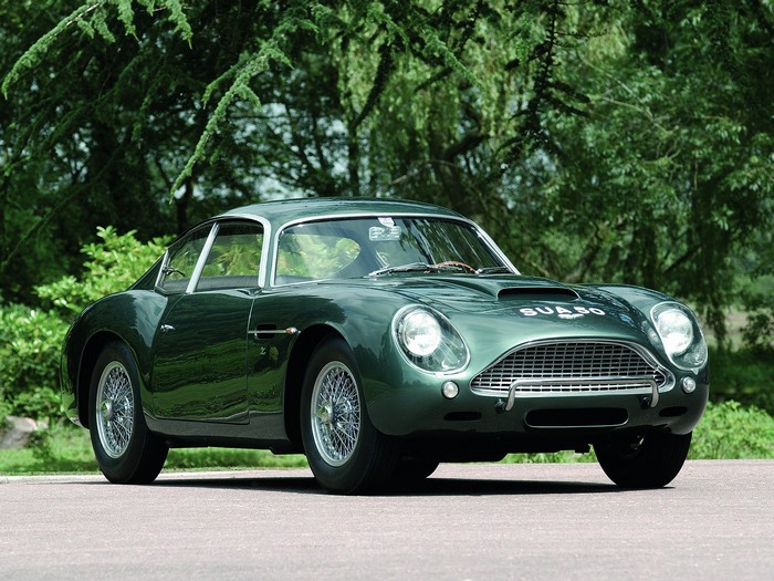 Green Aston Martin DB4 parked outdoors