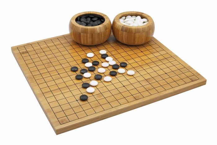 Go board with black and white stones