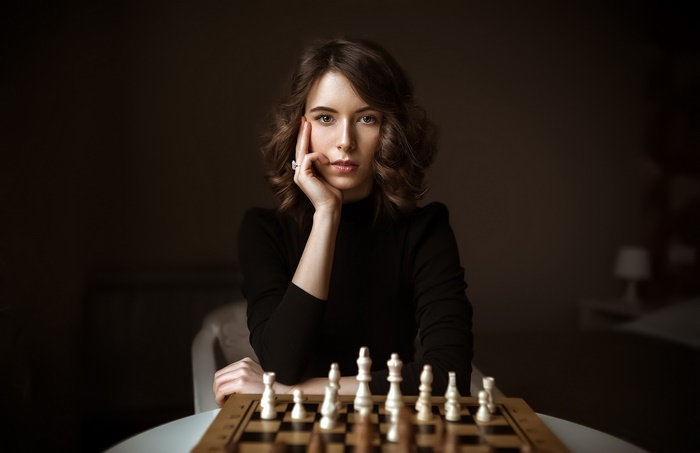 Brunette Woman Playing Chess