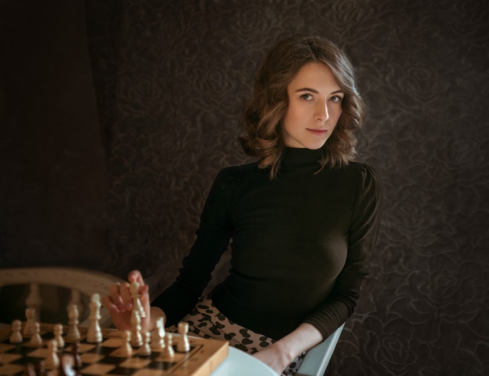 Brunette Woman Playing Chess