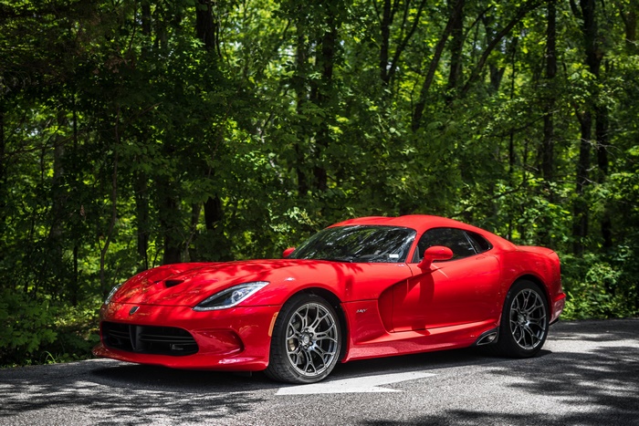 Red Dodge Viper SRT car on a road