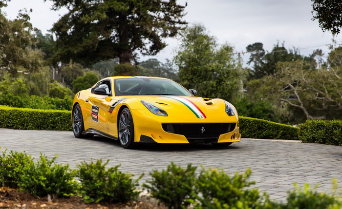 Yellow Ferrari F12berlinetta with racing stripes