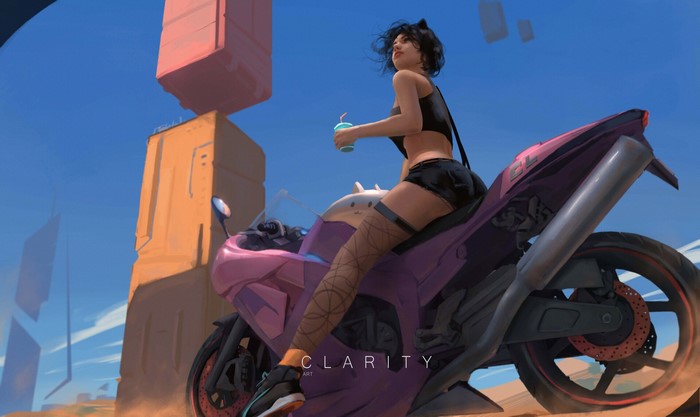 Girl on a pink motorcycle in a desert landscape