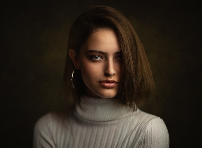 Woman with brunette hair wearing a turtleneck