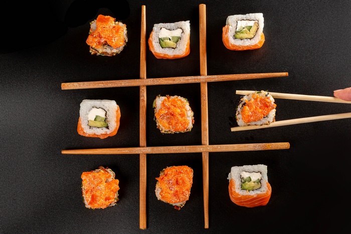 Sushi tic-tac-toe game with chopsticks