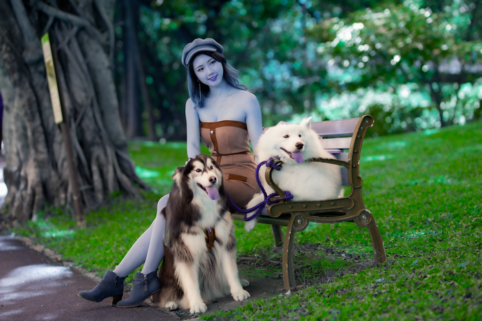Asian Woman with Two Dogs in Park