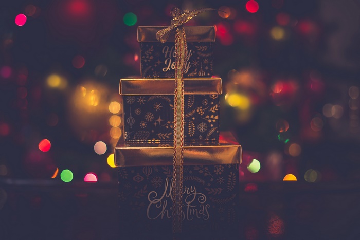 Stack of Christmas Gifts with Bokeh Lights