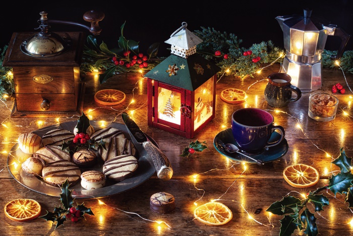 Christmas cookies and coffee with lantern and grinder