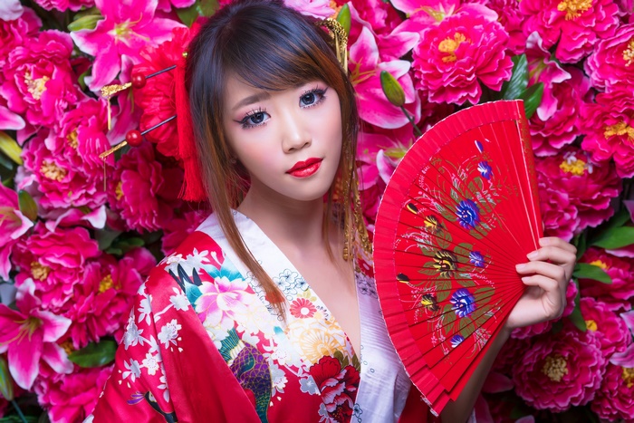 Woman in Kimono Holding a Fan with Flowers