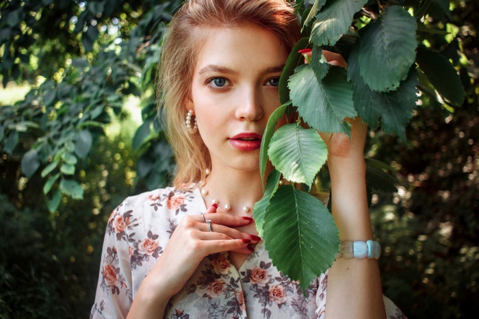 Woman with blonde hair and blue eyes