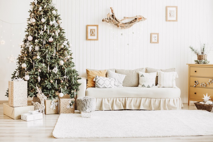 Christmas Tree and Sofa in a White Themed Room