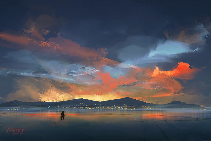 Person walking on frozen lake at sunset with mountains and city lights