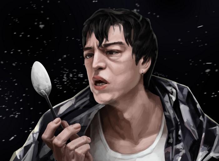 Joji holding a spoon