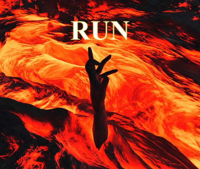 RUN text over lava with hand