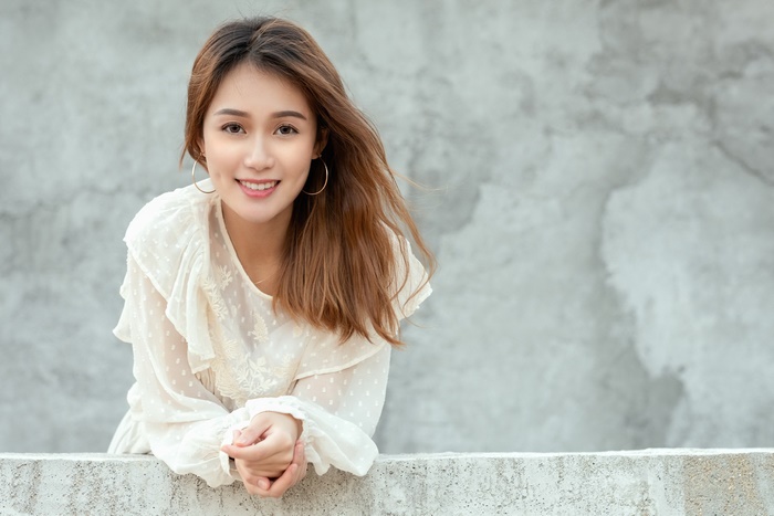 Asian Woman Smiling with Brunette Hair