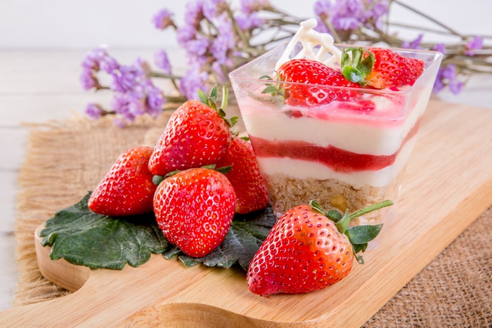 Strawberry dessert with fresh strawberries and flowers