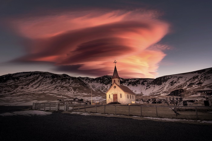 Church in Iceland with Lenticular Clouds at Sunset