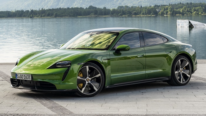 Green Porsche Taycan Turbo S Electric Sedan by a Lake